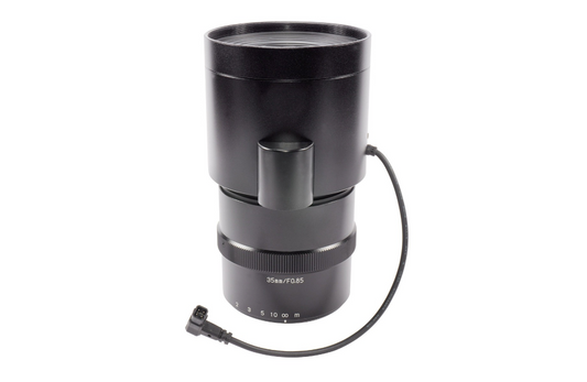 Black camera lens with a cable on a white background